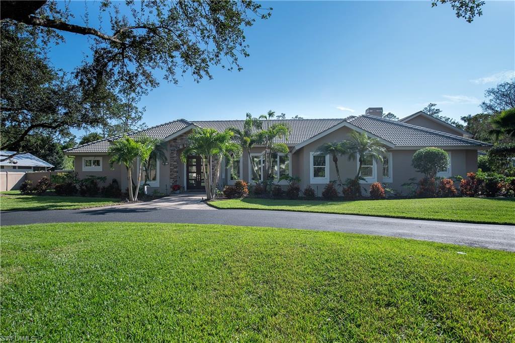 6610 Sable Ridge Lane Naples, FL 34109 - Photo 26 of 50 a view of a house with a swimming pool