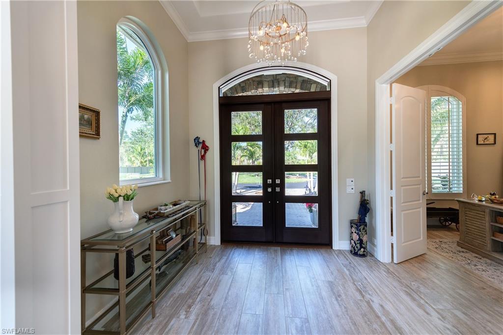 6610 Sable Ridge Lane Naples, FL 34109 - Photo 28 of 50 a view of a room with furniture and windows