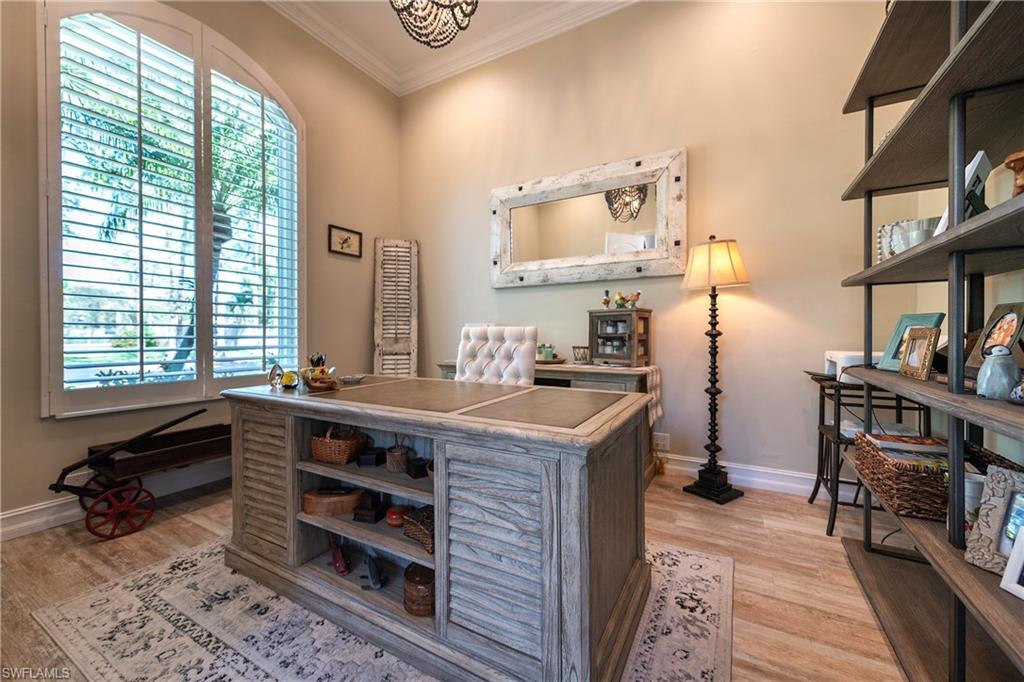 6610 Sable Ridge Lane Naples, FL 34109 - Photo 30 of 50 a kitchen with a stove and cabinets