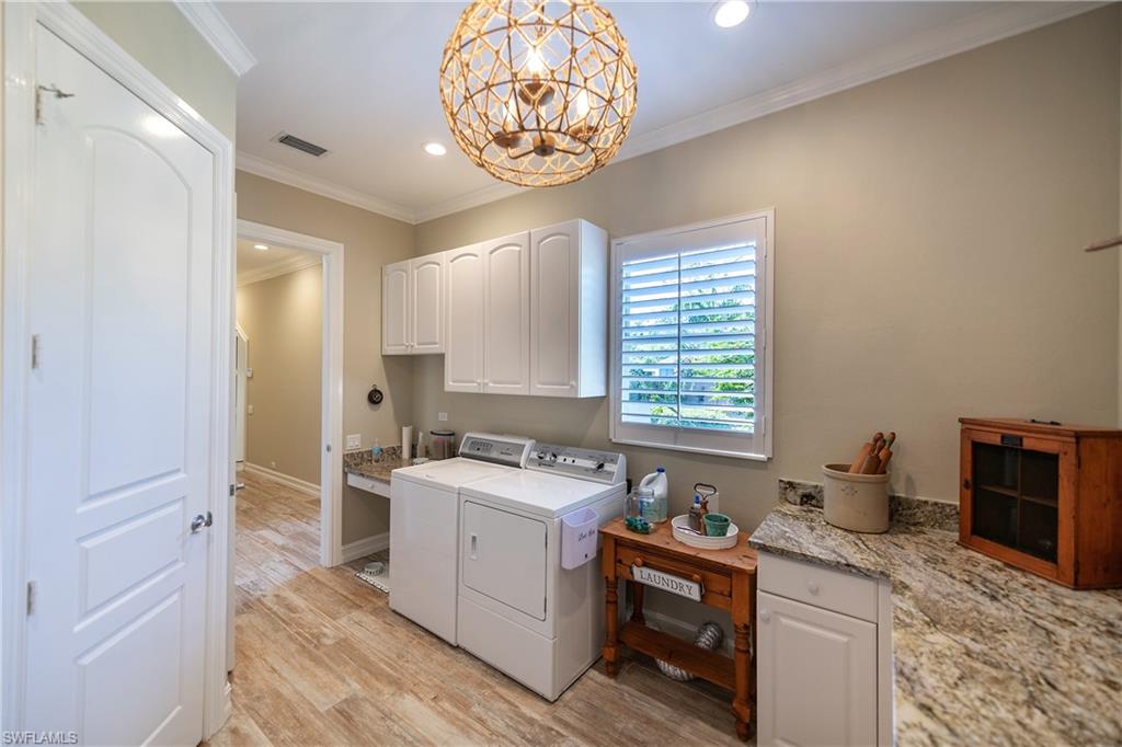 6610 Sable Ridge Lane Naples, FL 34109 - Photo 39 of 50 a kitchen with a sink cabinets and window