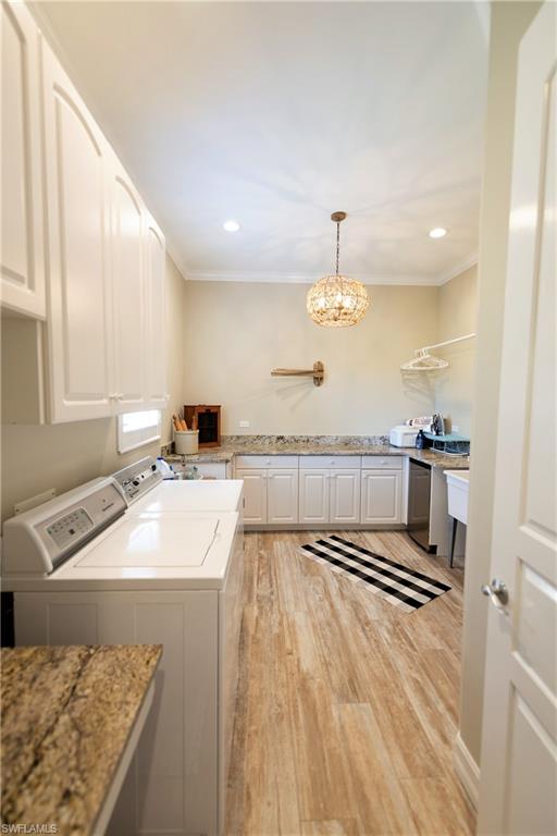 6610 Sable Ridge Lane Naples, FL 34109 - Photo 40 of 50 a kitchen with a sink stove and cabinets