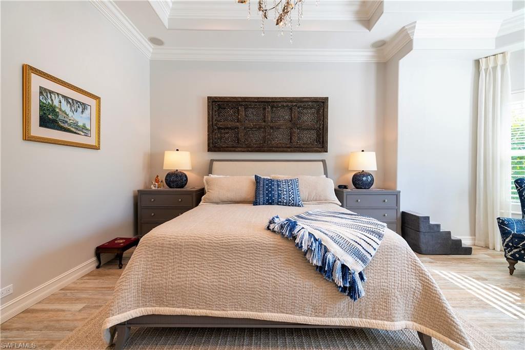 6610 Sable Ridge Lane Naples, FL 34109 - Photo 44 of 50 a bedroom with bed and a window