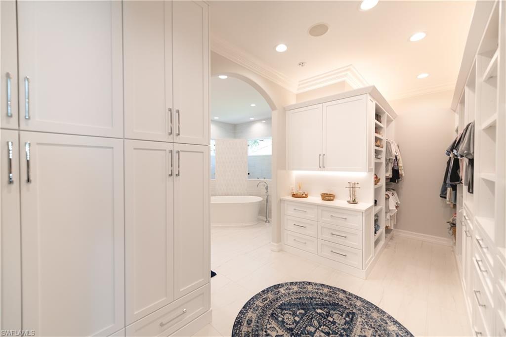 6610 Sable Ridge Lane Naples, FL 34109 - Photo 47 of 50 a bathroom with a bathtub and a shower