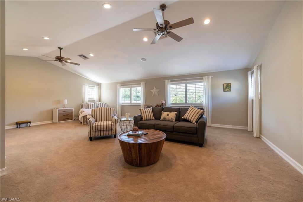 6610 Sable Ridge Lane Naples, FL 34109 - Photo 50 of 50 a living room with furniture and a chandelier