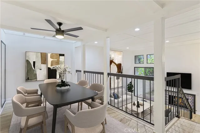 a view of a dining room with furniture and a chandelier