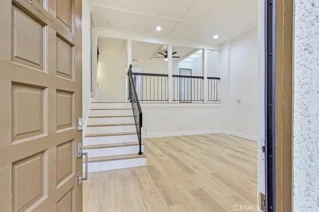 a view of entryway with wooden floor