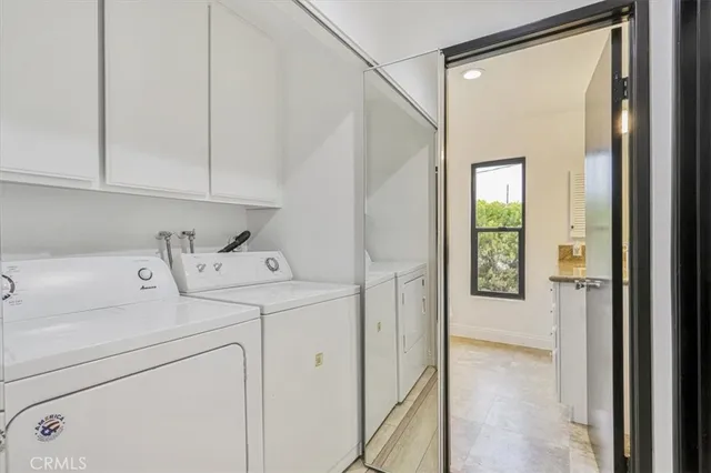 a view of storage and utility room with washer and dryer