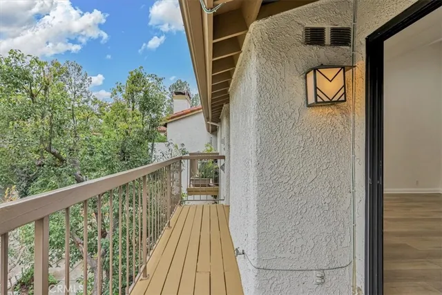 a view of balcony with furniture
