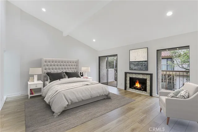 a bedroom with a bed and a fireplace