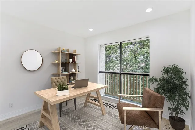 a living room with furniture a rug and a large window