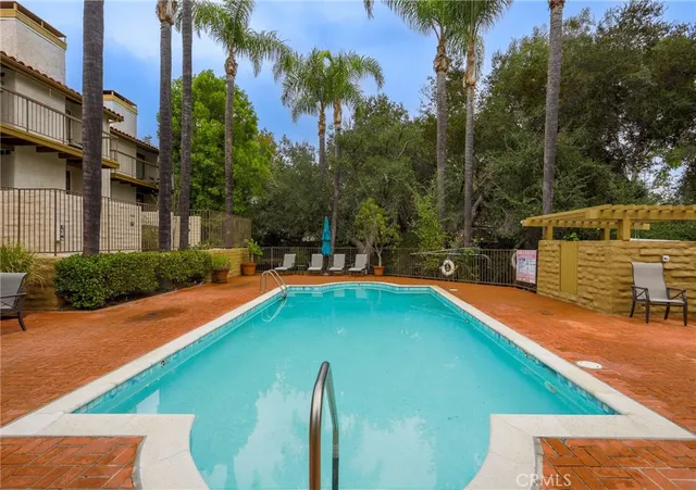 a view of an outdoor space pool patio and lake view