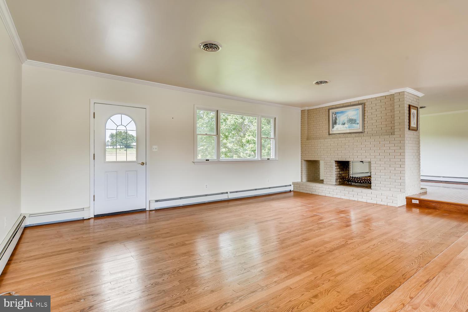 1919 Mayberry Road Westminster, MD 21158 - Photo 5 of 28 Double sided fireplace w/ wood storage box