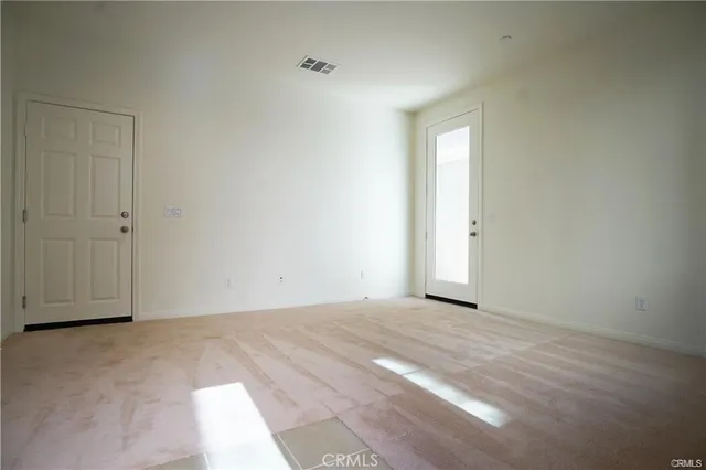 a view of an empty room and window