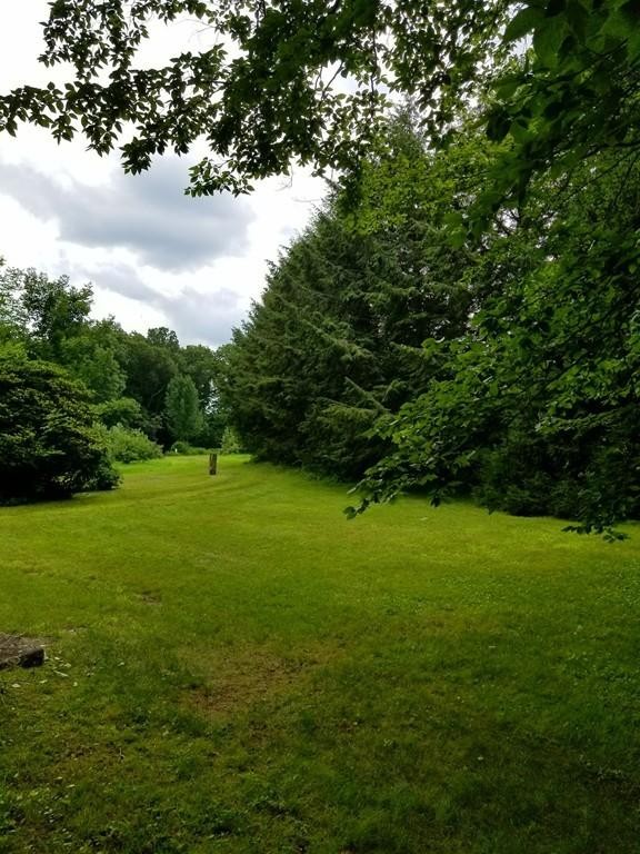 168 Bolton Road Harvard, MA 01451 - Photo 2 of 12 a view of field with trees in the background