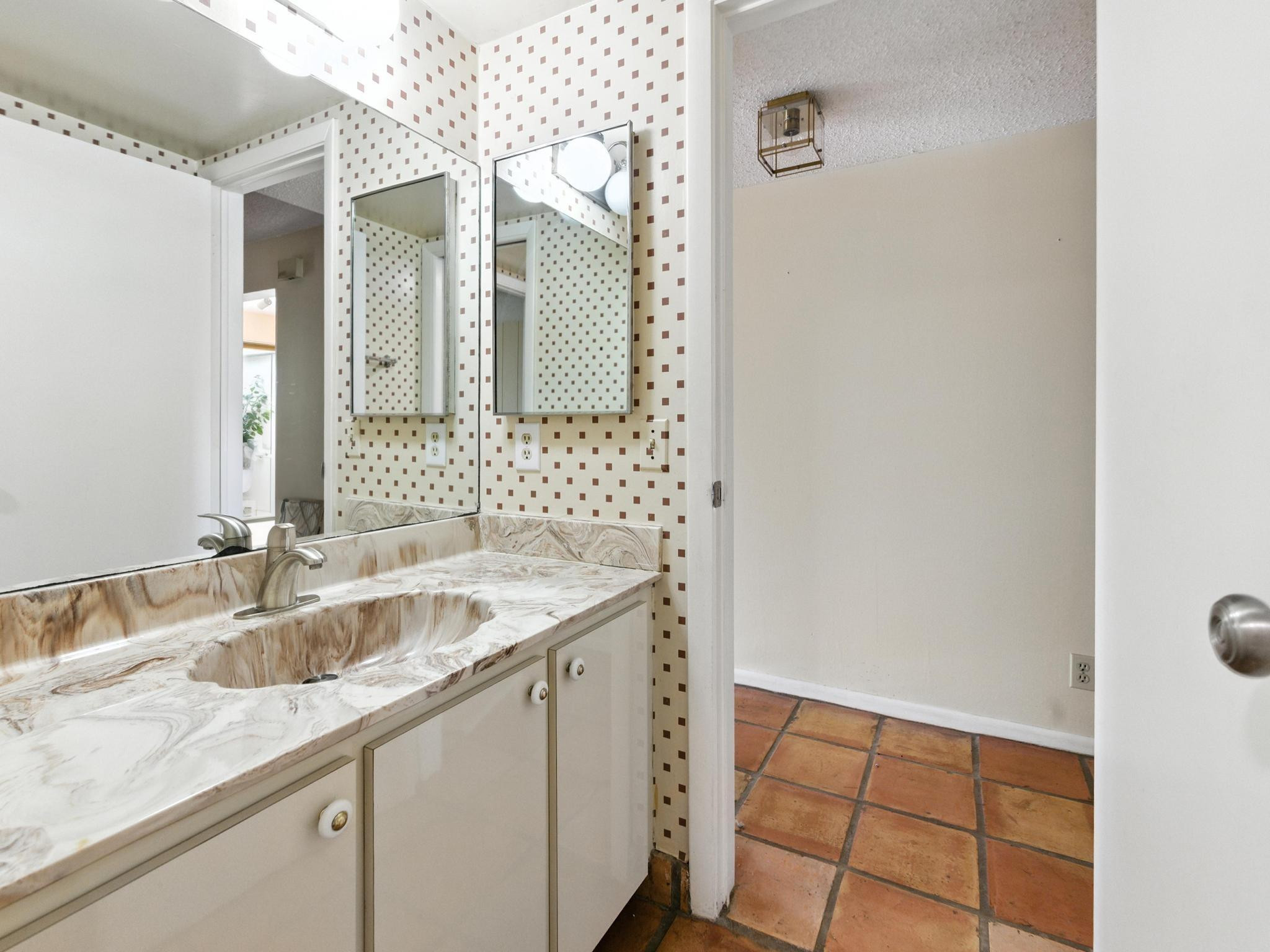 203 Bonnie Brae Way, Unit 34 Hollywood, FL 33021 - Photo 16 of 41 a bathroom with a sink and a mirror
