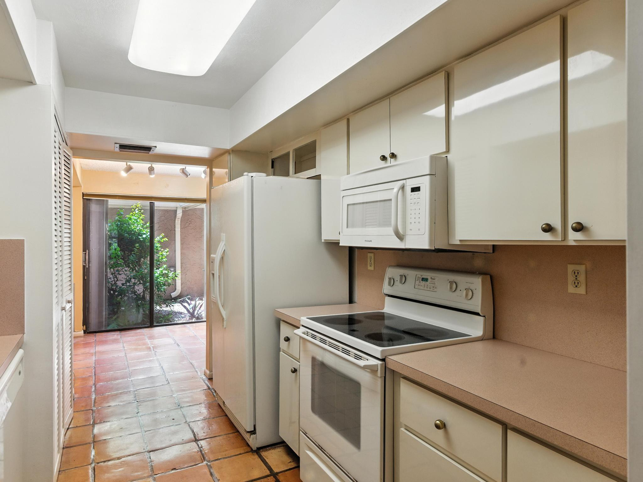 203 Bonnie Brae Way, Unit 34 Hollywood, FL 33021 - Photo 23 of 41 a kitchen with stainless steel appliances a refrigerator sink and cabinets