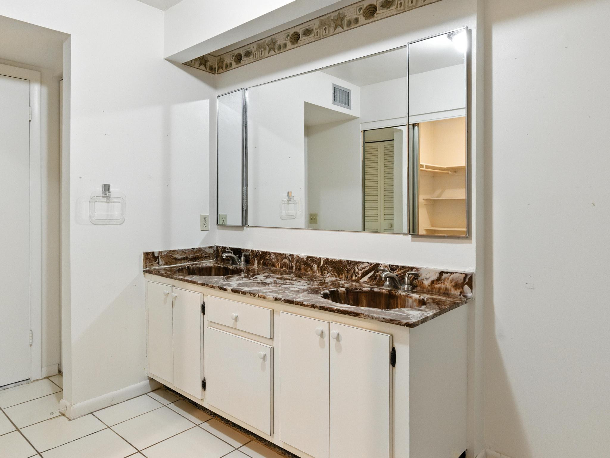 203 Bonnie Brae Way, Unit 34 Hollywood, FL 33021 - Photo 27 of 41 a bathroom with a granite countertop sink and a mirror