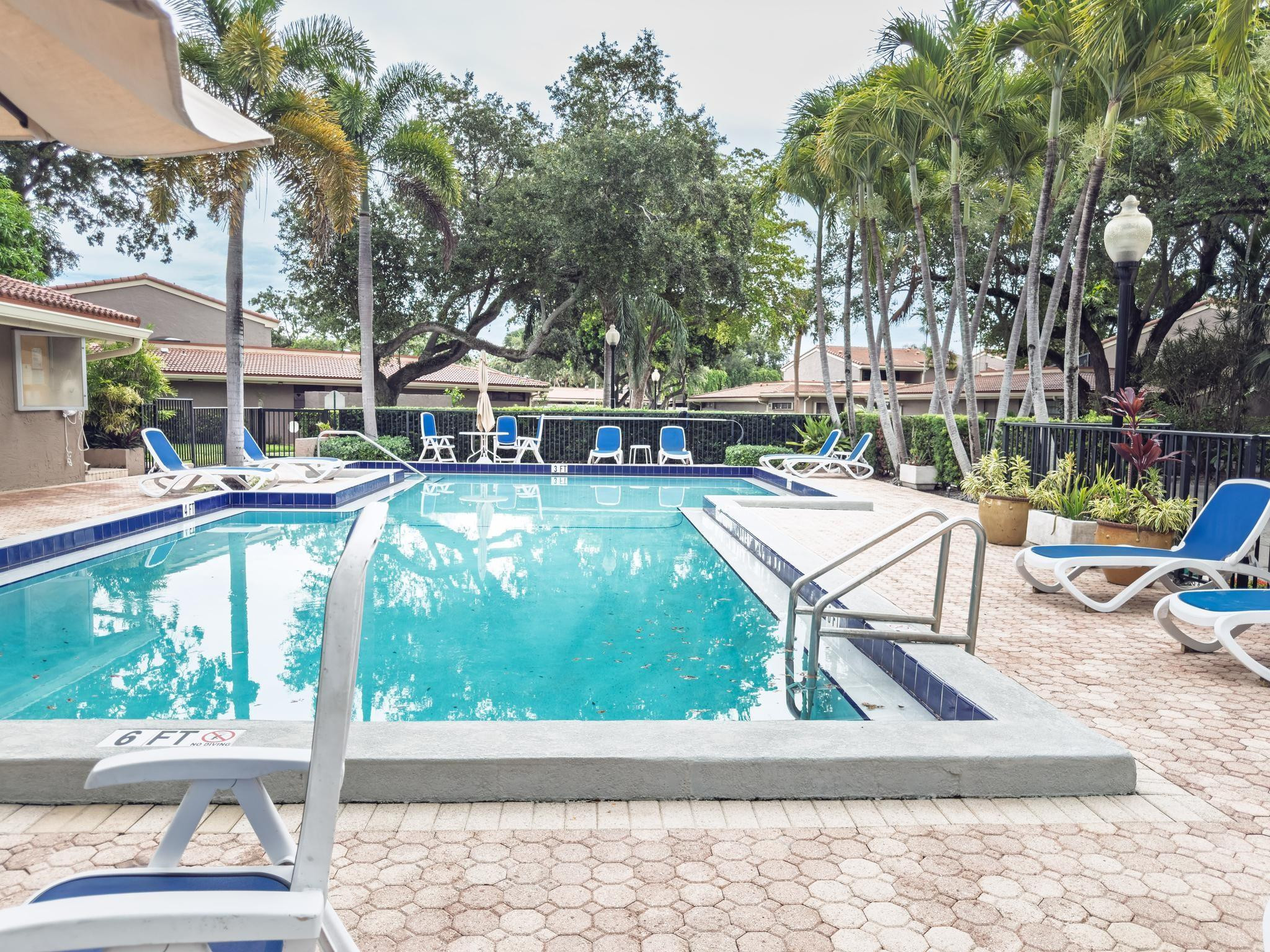 203 Bonnie Brae Way, Unit 34 Hollywood, FL 33021 - Photo 41 of 41 a building outdoor space with patio furniture and potted plants