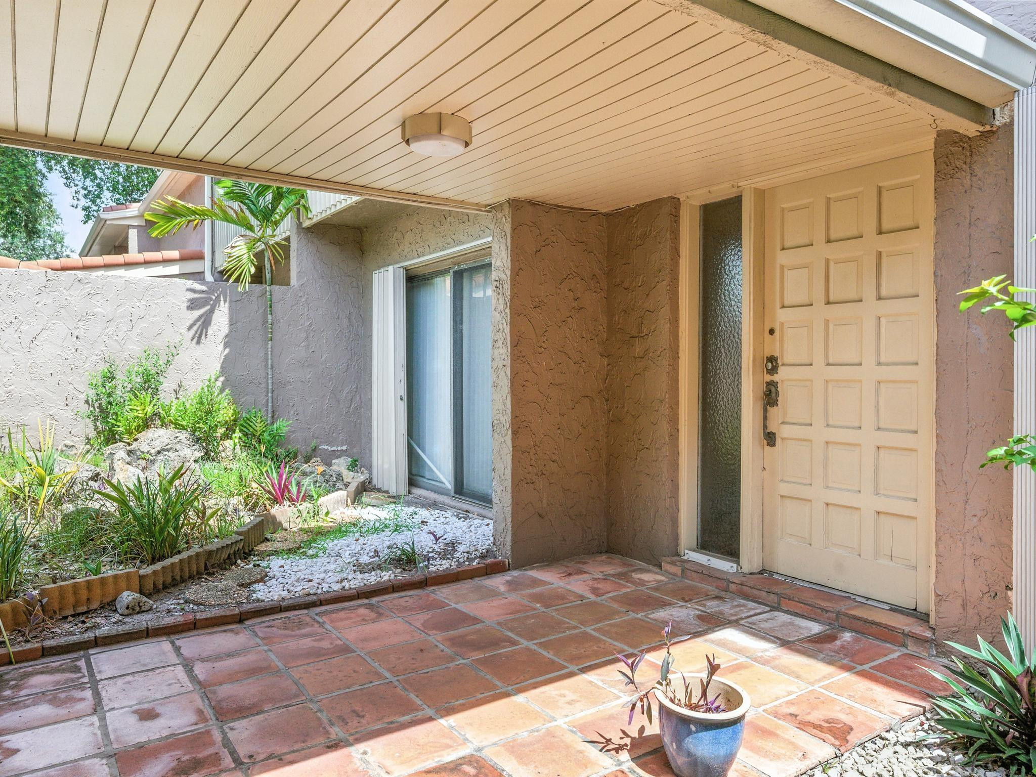203 Bonnie Brae Way, Unit 34 Hollywood, FL 33021 - Photo 5 of 41 a view of a entryway door of the house