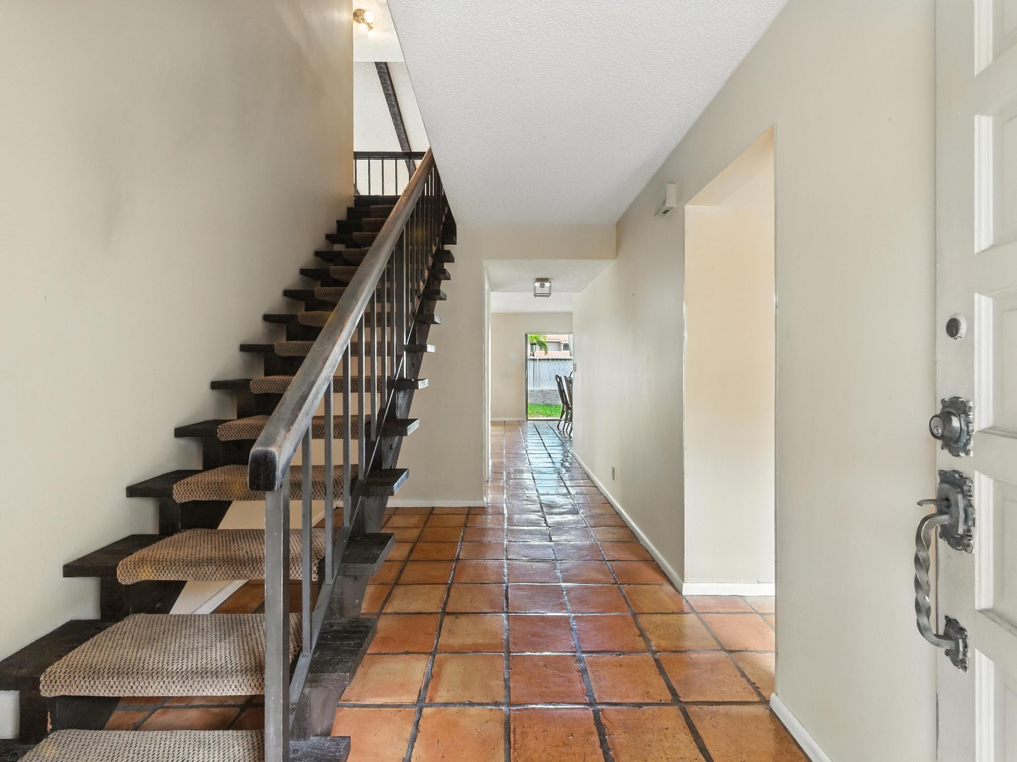 203 Bonnie Brae Way, Unit 34 Hollywood, FL 33021 - Photo 9 of 41 a view of entryway and hall with wooden floor