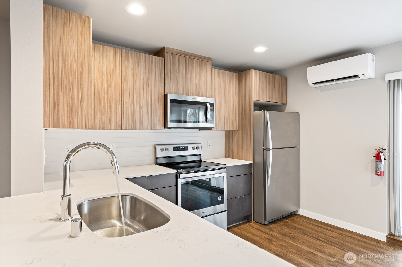 4910 South Willow Street, Unit B Seattle, WA 98118 - Photo 11 of 28 a kitchen with a refrigerator sink and wooden cabinets
