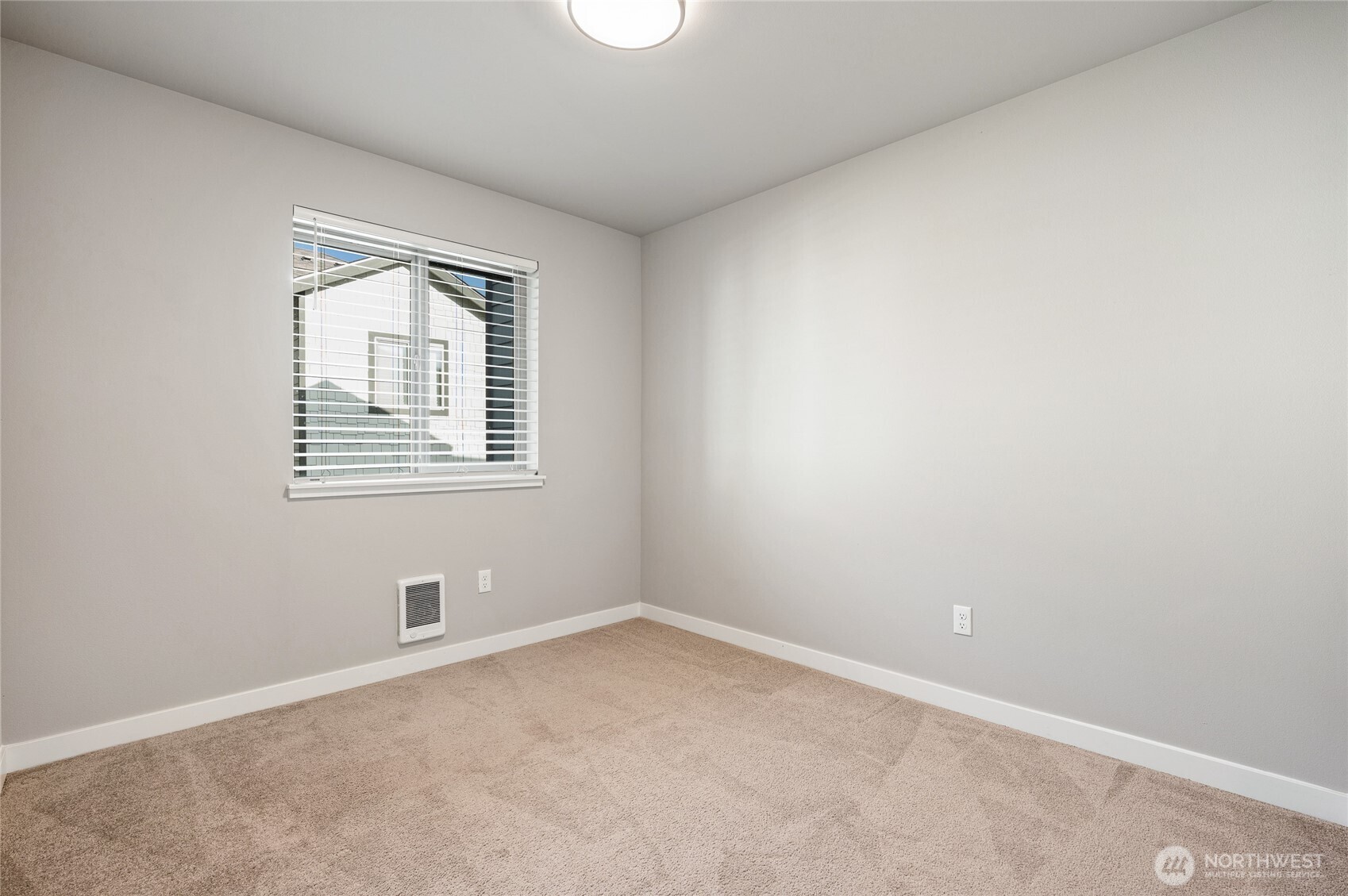 4910 South Willow Street, Unit B Seattle, WA 98118 - Photo 19 of 28 an empty room with windows