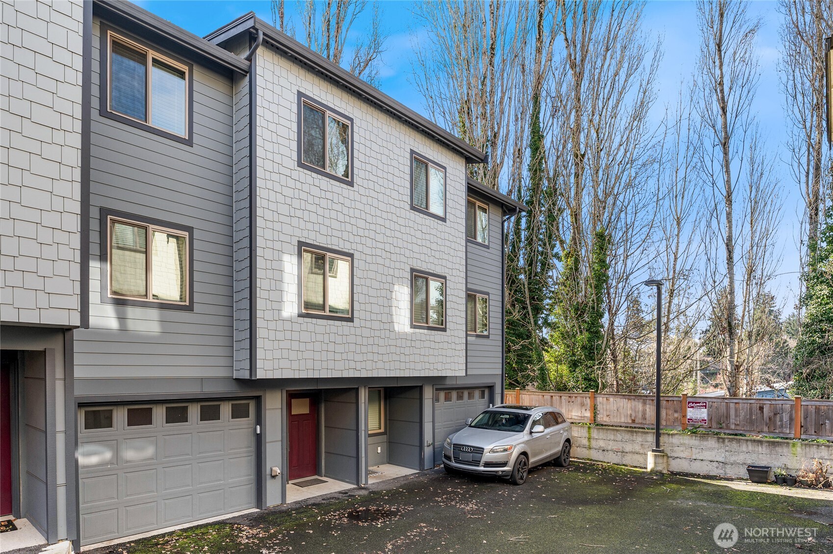 4910 South Willow Street, Unit B Seattle, WA 98118 - Photo 25 of 28 a car parked in front of a brick house