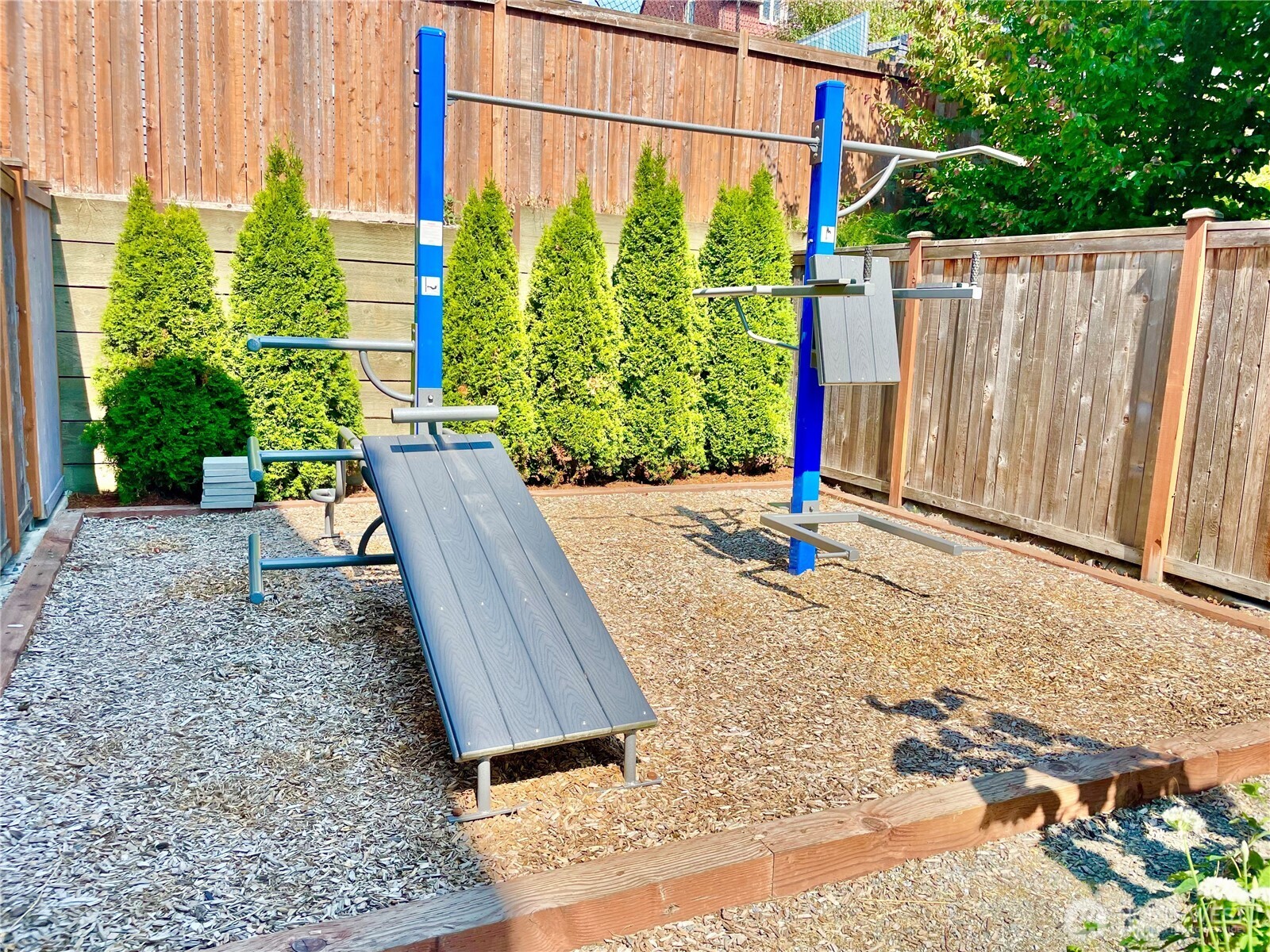 4910 South Willow Street, Unit B Seattle, WA 98118 - Photo 28 of 28 a backyard of a house with lots of green space