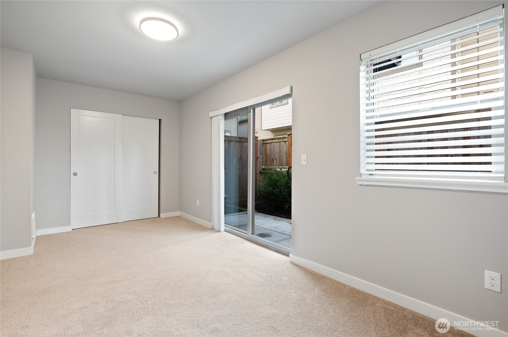 4910 South Willow Street, Unit B Seattle, WA 98118 - Photo 3 of 28 an empty room with windows