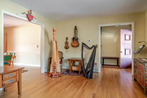 a living room with furniture a fireplace and a window