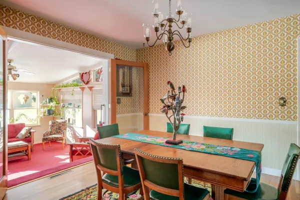 a refrigerator and a stove sitting inside of a kitchen