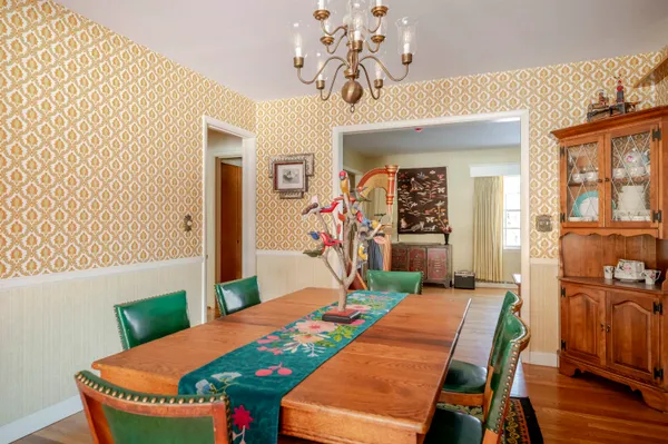 a kitchen with granite countertop cabinets sink and white appliances