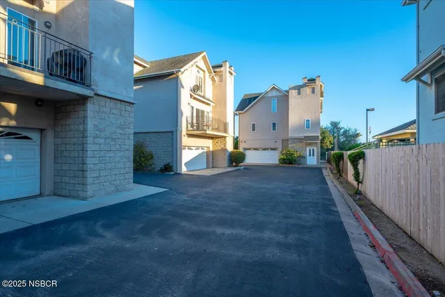 a view of a house with a street