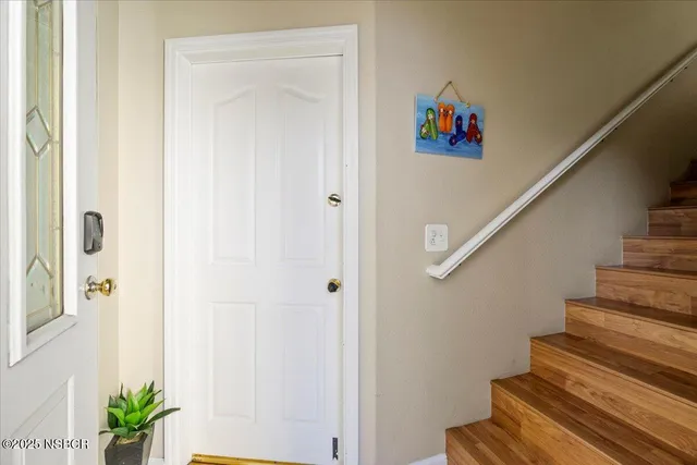 a view of entryway with wooden floor