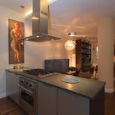 a kitchen with a stove and a sink