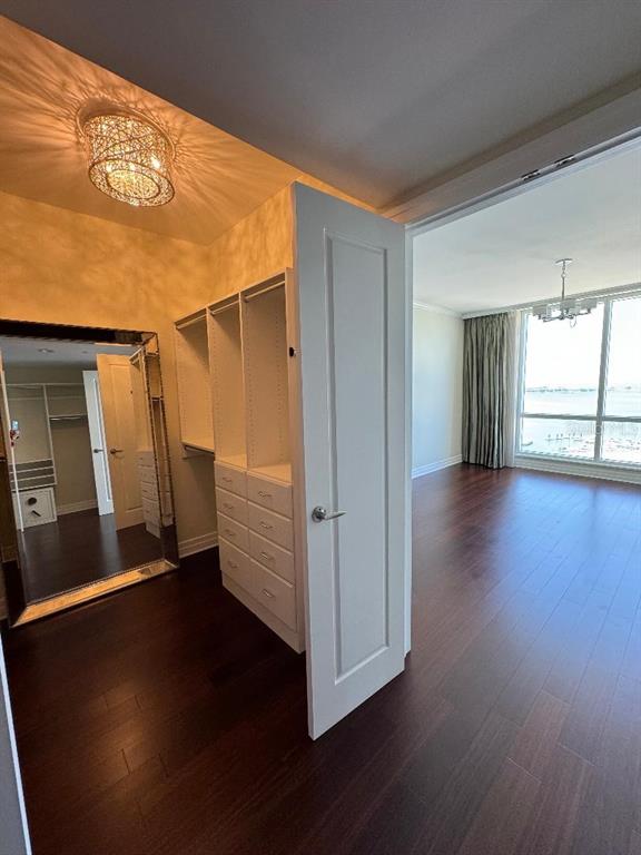331 Cleveland Street, Unit 1504 Clearwater, FL 33755 - Photo 19 of 46 a view of an empty room with wooden floor and a window