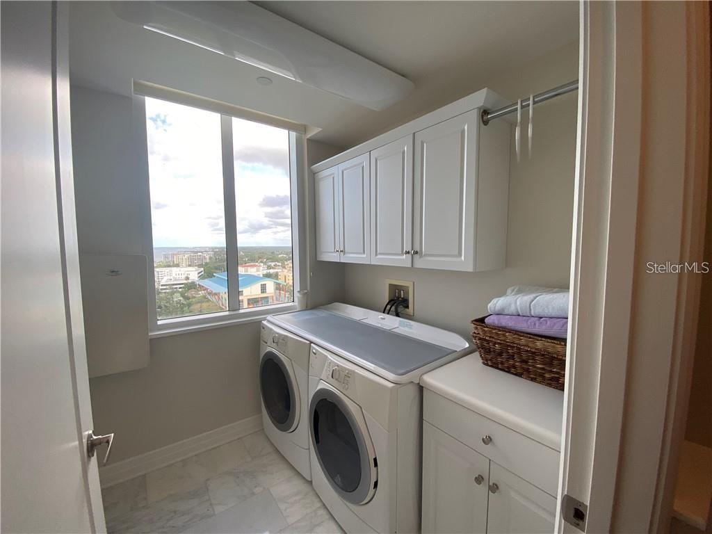 331 Cleveland Street, Unit 1504 Clearwater, FL 33755 - Photo 26 of 46 a utility room with dryer and washer