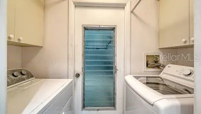 a kitchen that has a sink and a stove