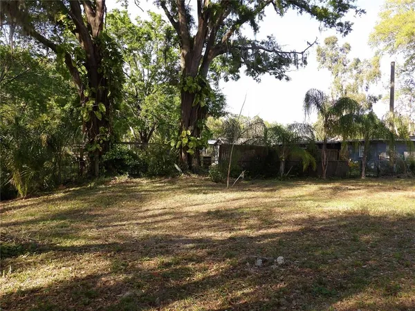 a backyard of a house with lots of green space