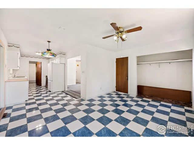 a living room with a black white checkered floor with a black white checkered floor