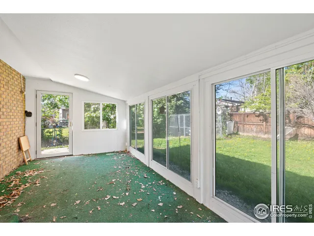 a view of a room that has a bed