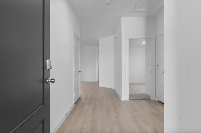 a view of a hallway with closet