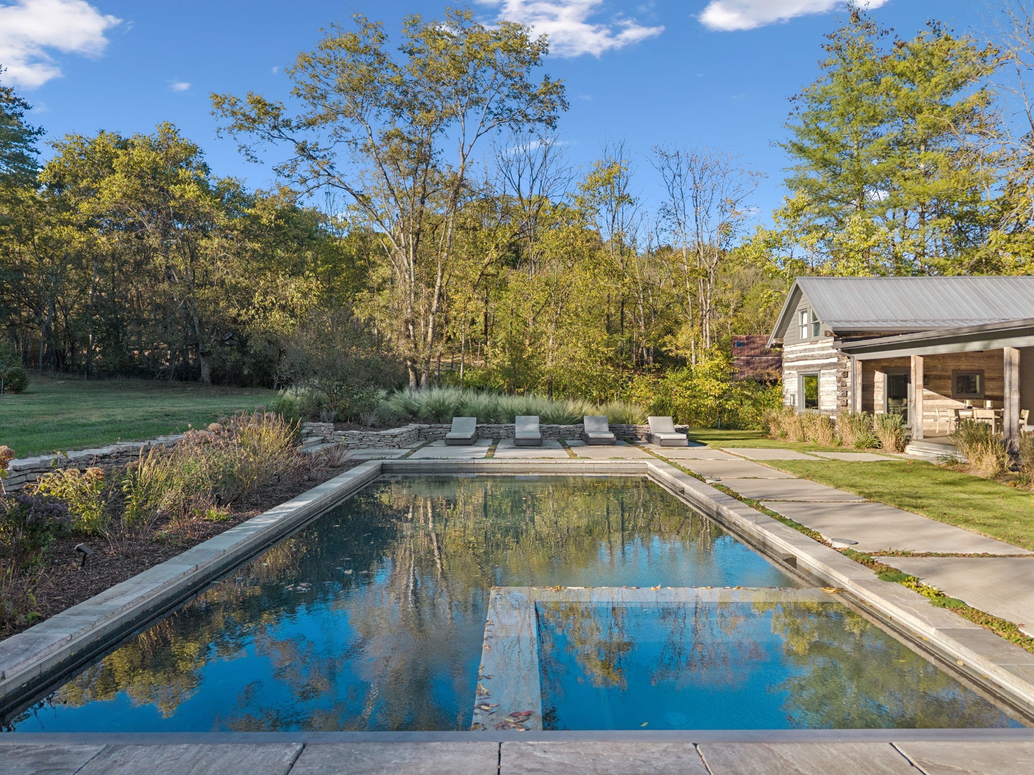 2060 Old Hillsboro Road Franklin, TN 37064 - Photo 63 of 75 a view of a swimming pool with a lounge chairs