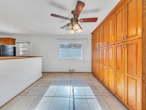 a view of balcony with wooden floor and fence
