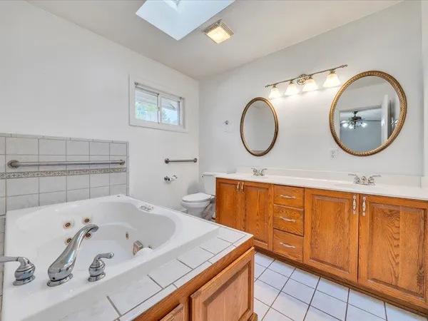 a bathroom with a toilet and a shower curtain