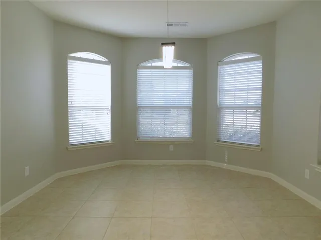 a kitchen with a stove sink and cabinets