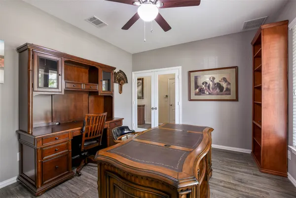 a room with furniture and wooden floor