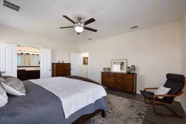 a bedroom with a bed and furniture