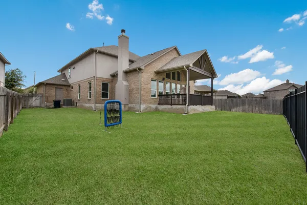 a house view with a garden space