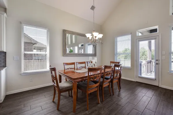 a view of a dining room with furniture and window